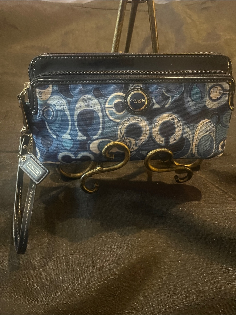 Navy blue patent leather & light blue Coach wristlet.